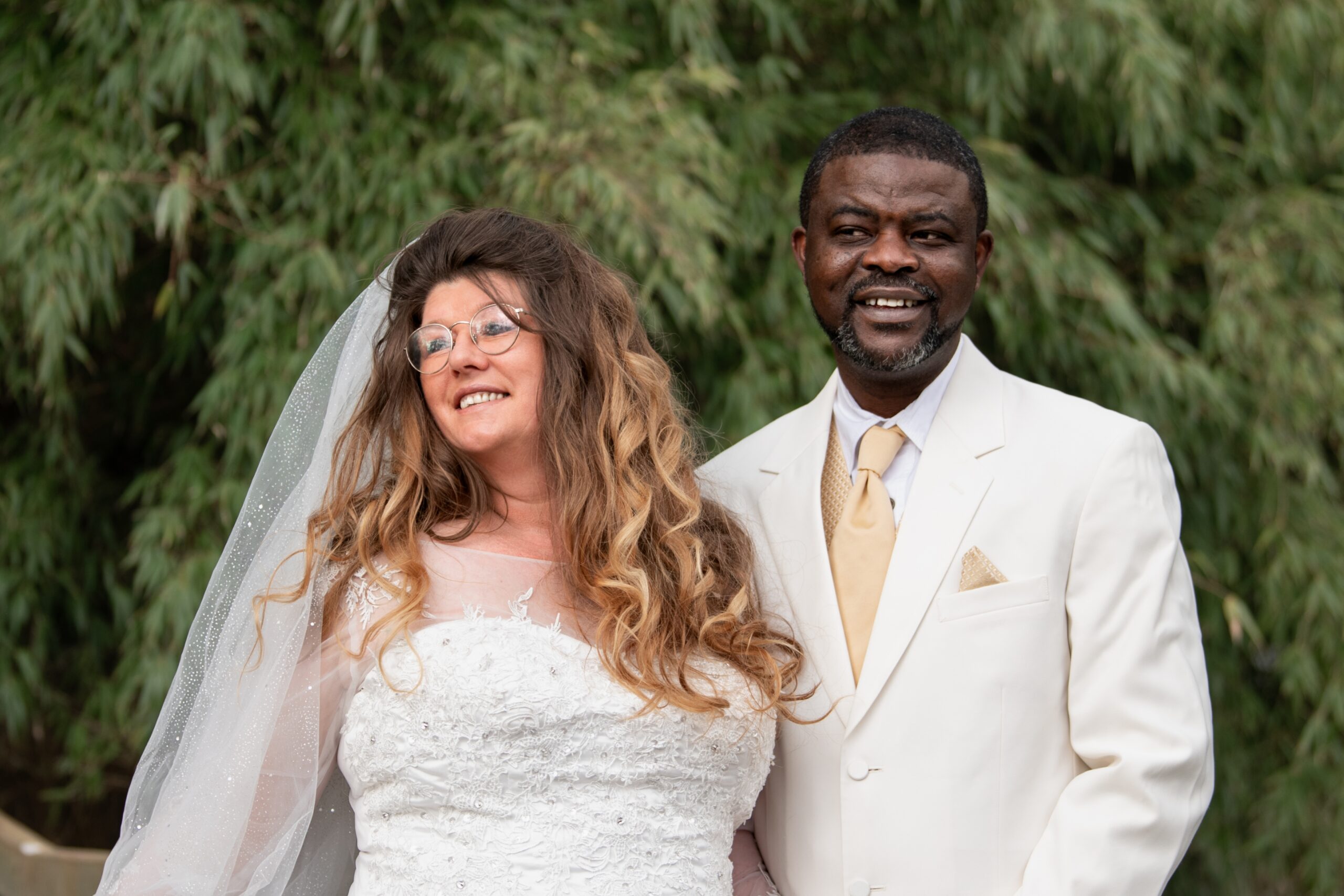 Caucasian and African couple holding hand with ring